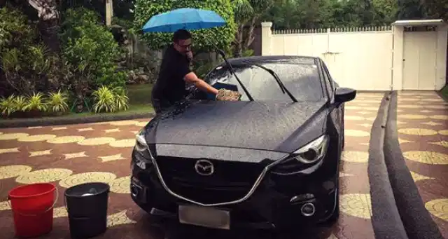Cleaning car in the rian